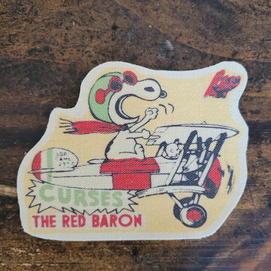 Snoopy curses Red Baron